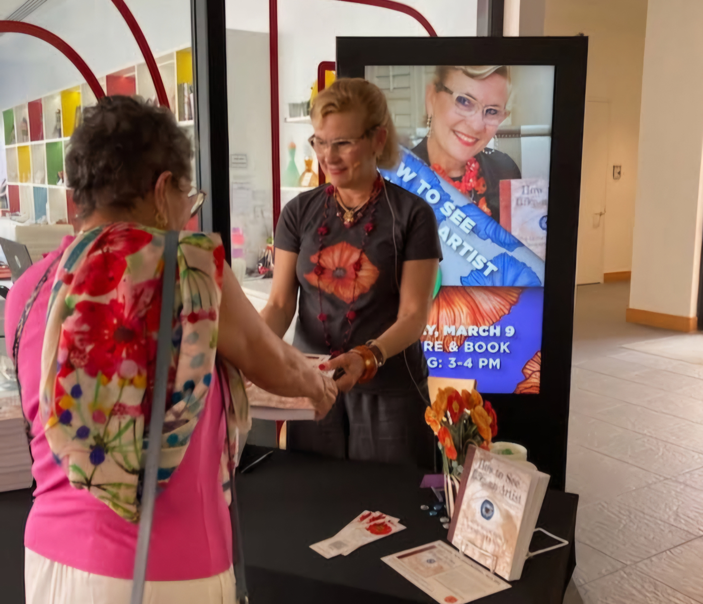 Ariane signs her book 